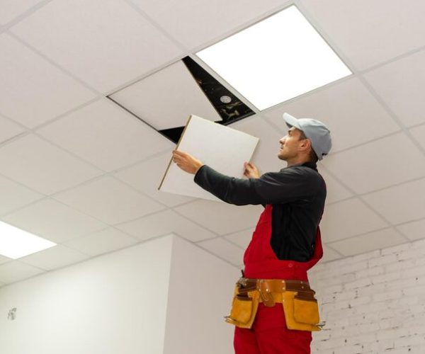 ceiling-installation-with-expert-technicians-room-that-is-construction-process_493343-28800
